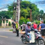 Polsek Tanjung Laksanakan Pengamanan dan Pengawalan Giat Kremasi Warga di Desa Tanjung